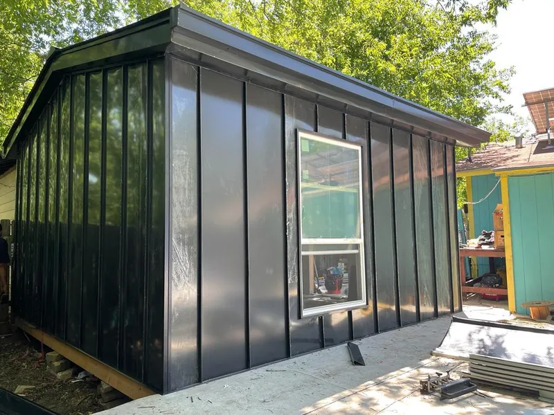 Black standing seam metal wall panels for Roof Inspection in Lake Ridge