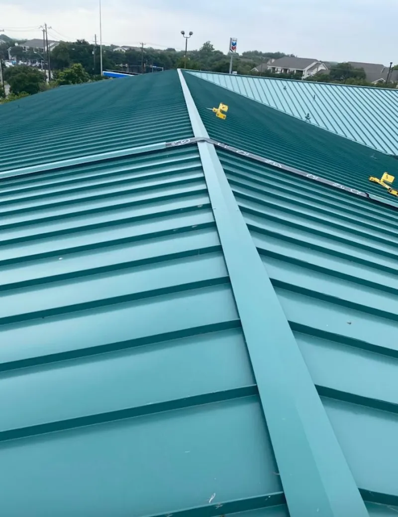 Green commercial metal roof ridge and valley for Metal Roof Repair in Lake Ridge